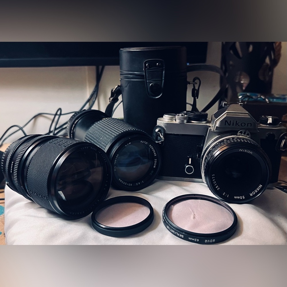 Nikon Silver and Black Film Camera with Lenses
